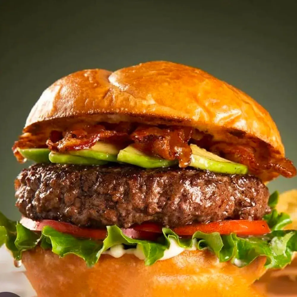 Steak burger with salad in a brioche bun